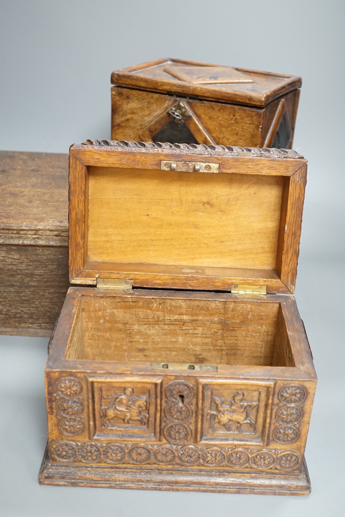 An early 18th century oak bible box containing a Victorian Morocco leather photograph album, together with two 19th century wooden boxes (4)